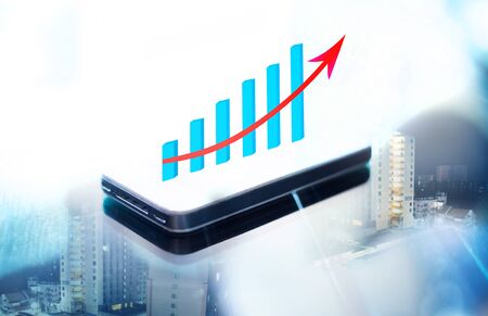 Double expose of business graph on smart phone screenの写真素材