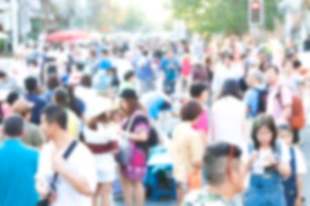 Crowd of anonymous people walking on busy Chiang Mai street, blurred peopleの写真素材