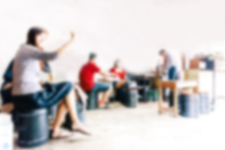 blurred background of sitting people in coffee cafe