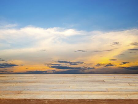 Empty wooden table with blue sky and cloud, product displayの写真素材