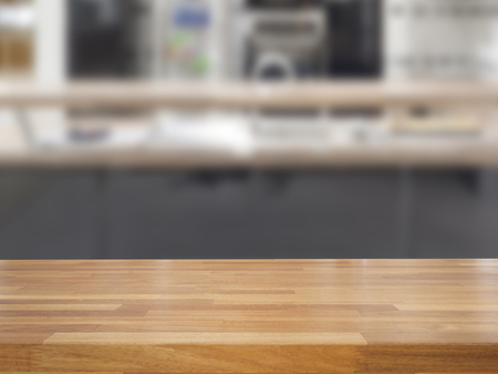 Empty wooden table and blurred kitchen background, product displayの写真素材