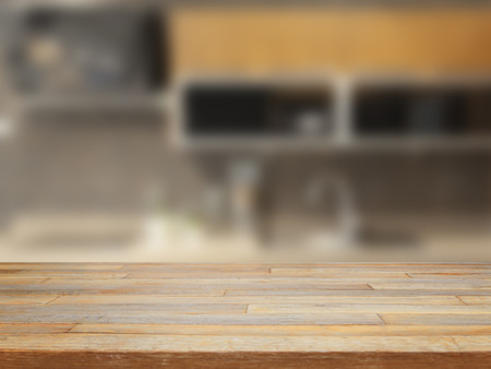 Empty wooden table and blurred kitchen background product displayの写真素材