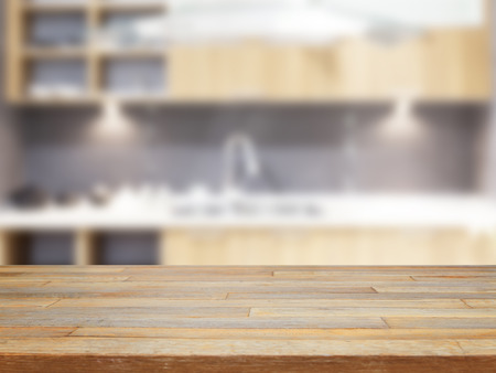 Empty wooden table and blurred kitchen background product displayの写真素材