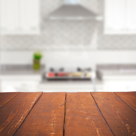 Empty wooden table and blurred kitchen background, product displayの写真素材
