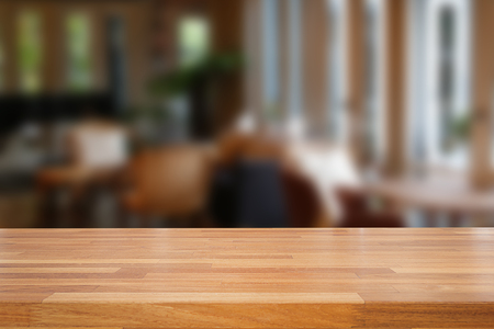 Empty wooden table and blurred cafe background,product displayの写真素材