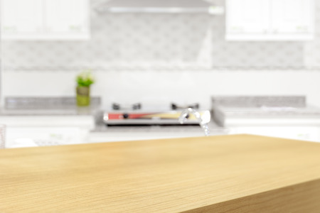Empty wooden table and blurred kitchen background, product displayの写真素材