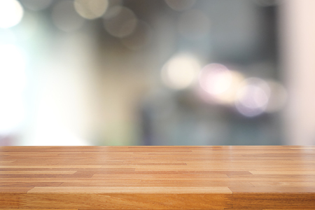 Empty wooden table and blurred kitchen background, product montage display Empty wooden table and blurred kitchen background, product montage display