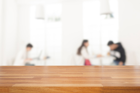 Empty wooden table and blurred people in cafe background, product display.Ready for product montageの写真素材