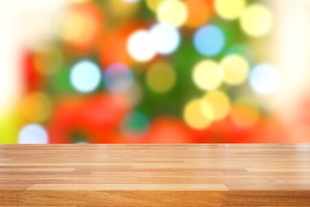 Christmas holiday background with empty wooden deck table over abstract festive bokeh. Ready for product montageの写真素材