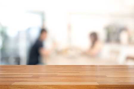 Empty wooden table and blurred people in cafe background, product display.Ready for product montageの写真素材