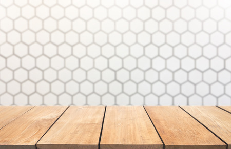 Empty wood table top with white blur  brick wall backgroundの写真素材