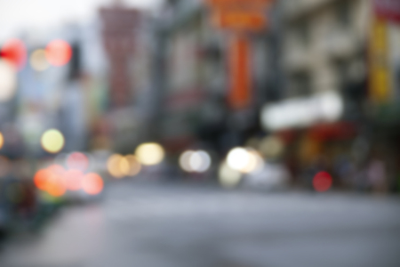 City lights abstract circular bokeh with blue color sunset, blurry building and street nightlife, abstract backgroundの写真素材