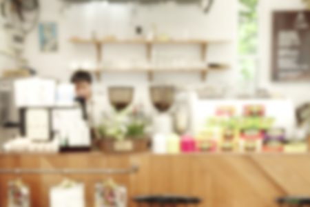 Blurred background of coffee shop with shelf bar background with bokehの写真素材