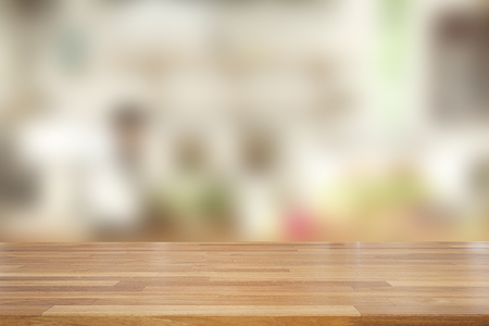 Empty wooden and table on abstract blurred background of coffee shop with shelf and window, product display, Ready for product montage