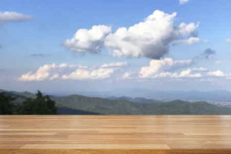 Empty wooden and table on abstract nature view with clound, blue sky, leaf and moutian background, product display, Ready for product montageの写真素材