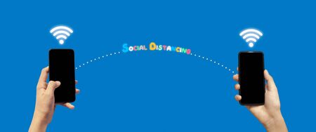 Hands showing smart phone screen on blue background.Social distancing concept. banner