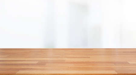 A beautiful empty wood board  with white blur glass window wall building background .For montage product display or design key visual layout background.の写真素材