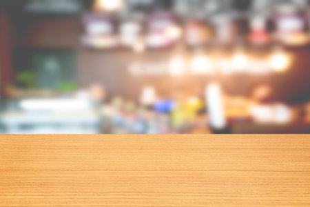 Empty wood table and Coffee shop blur background with bokeh image.の写真素材