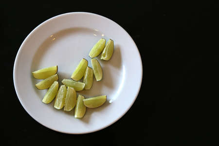 lemon slice on white dishの写真素材
