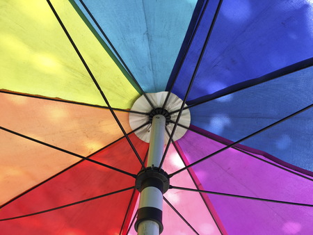 Under colorful umbrella in daytimeの写真素材