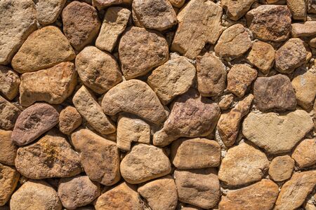 Stone wall texture background in daytime