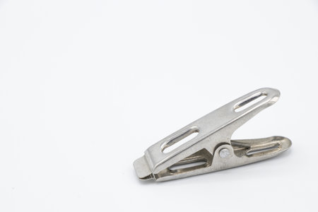 Metal cloth clip isolated on white backgroundの写真素材