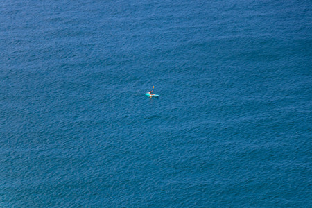 Men paddle kayak on the sea in daytime at Phuket province, Thailandの写真素材