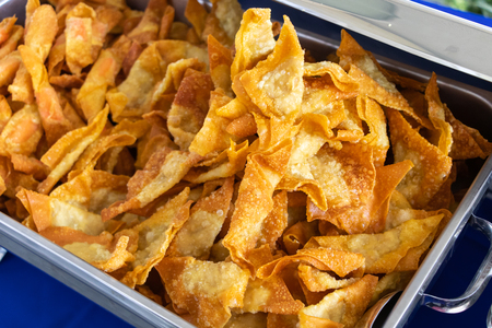 Deep fried pork wonton or fried dumplings in steel trayの写真素材