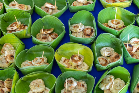 Grilled bananas on banana leaf, Thai dessertの写真素材