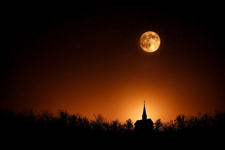 A Silhouette of old church against starry sky with full moon. scene evokes sense of tranquility and mystery, highlighting beauty of nature at nightの素材