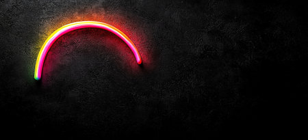 A glowing neon arc in pink and orange against black background creates vibrant and modern aesthetic. This striking design element adds touch of energy and creativity to any spaceの素材