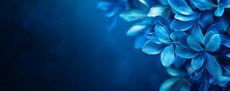 A Vibrant blue flowers create stunning contrast against dark background, evoking sense of tranquility and beauty. Perfect for nature themed designsの素材
