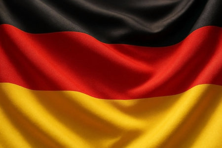 German national flag blowing in the wind. Perfect for background or texture purposes.の素材