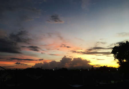 Beautiful sunset sky and clouds in evening. Color shade of nature background. Top view of twilight rural.の写真素材