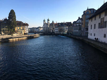 Old building in town with Reuss river in the winter season.の写真素材