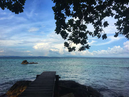 wooden bridge to the sea view. Tropical island backgroundの写真素材