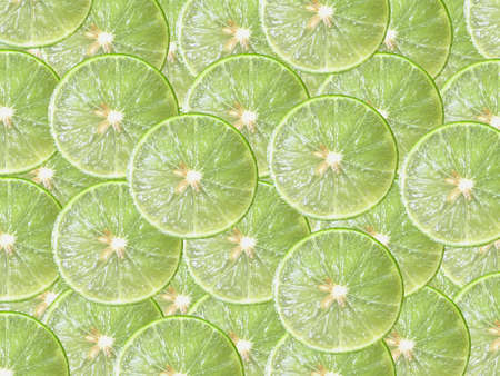 Juicy lime slice circle shape stacking and overlay backgroundの写真素材