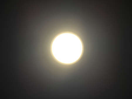 Circle warm white lighting lamp panel on ceiling by bottom view with soft focus. Light reflection...