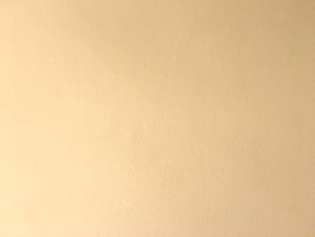 Light orange surface concrete wall texture. Rough pattern after plaster background.の写真素材