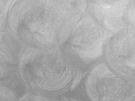 Abstract gray color circle plaster on the cement wall. Beautiful art interior building.