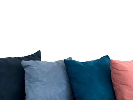 Colorful decorative resting pillow stack on sofa isolated on white background.の写真素材