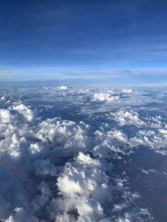 Beautiful blue sky and white cloud horizontal line from airplane view. Color shade of nature...