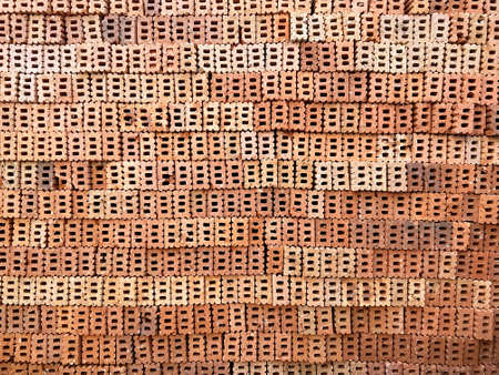 Orange brick wall at side to show hole and texture background.の写真素材
