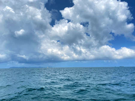 Beautiful calm sea wave under clear blue sky backgroundの写真素材