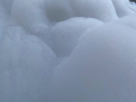 White softness foam bath in bathtub. Wavy surface background.の写真素材