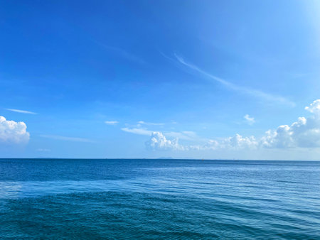 Beautiful calm sea wave under clear blue sky backgroundの写真素材