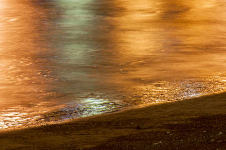 nocturnal beach in Playa Blanca Lanzarote with the reflections of the nightの写真素材