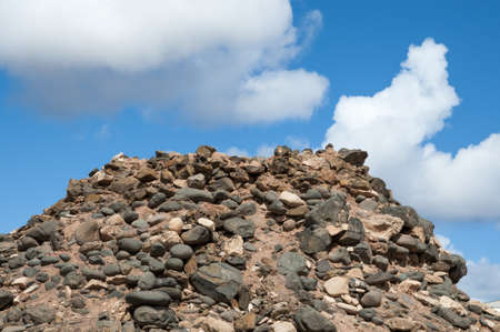 large stone mountain with blue sky backgroundの写真素材