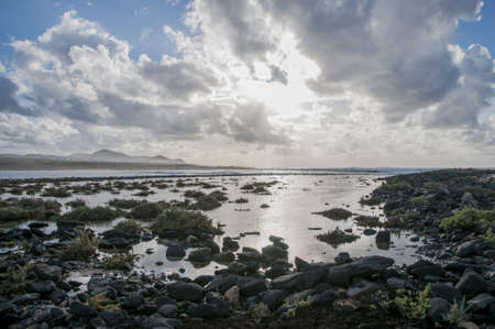 shingle beach with the sunset in the backgroundの写真素材