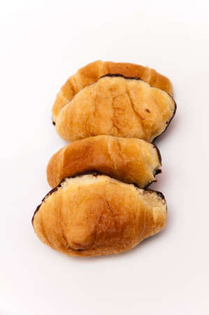 chocolate croissants on white backgroundの写真素材